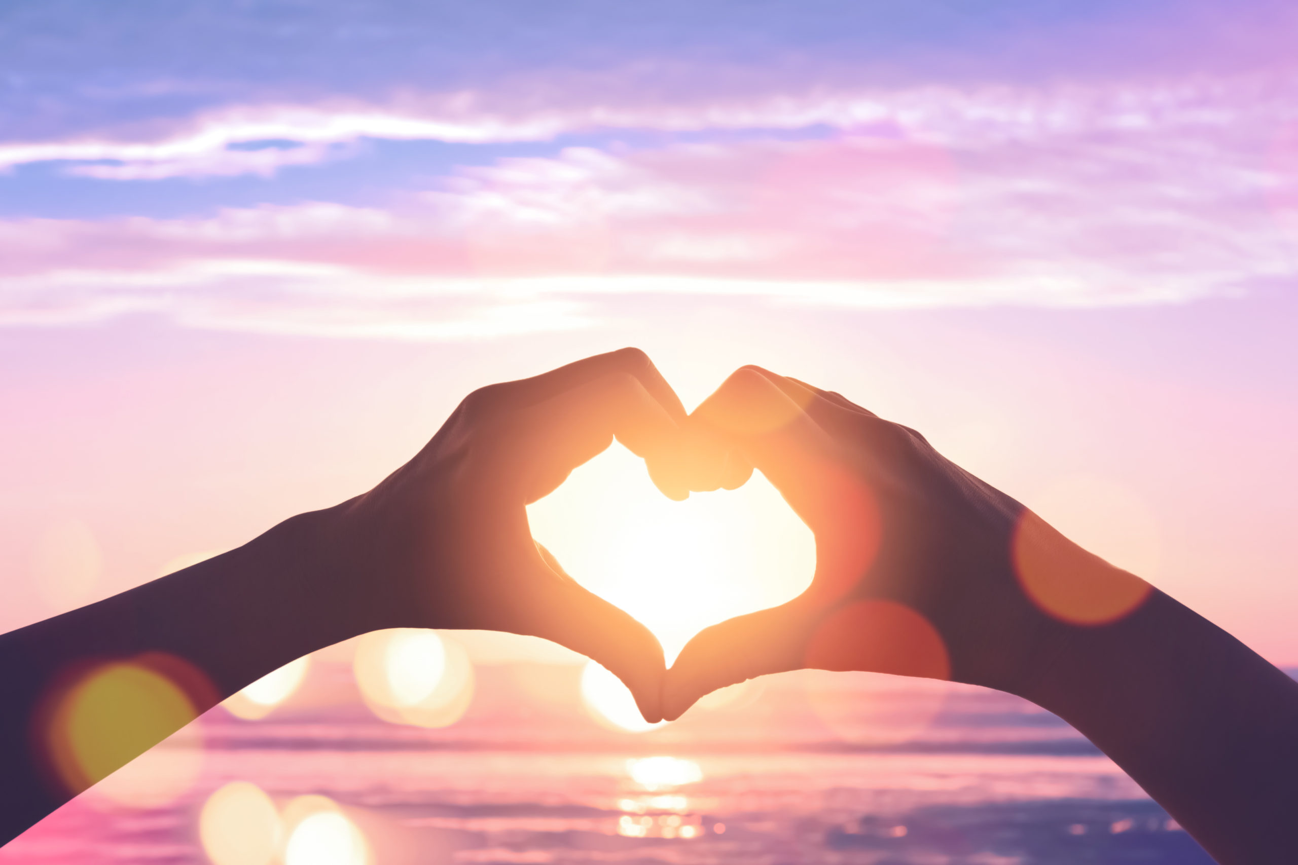 Female Hands Heart Shape On Sunset Sky At Tropical Beach Abstrac